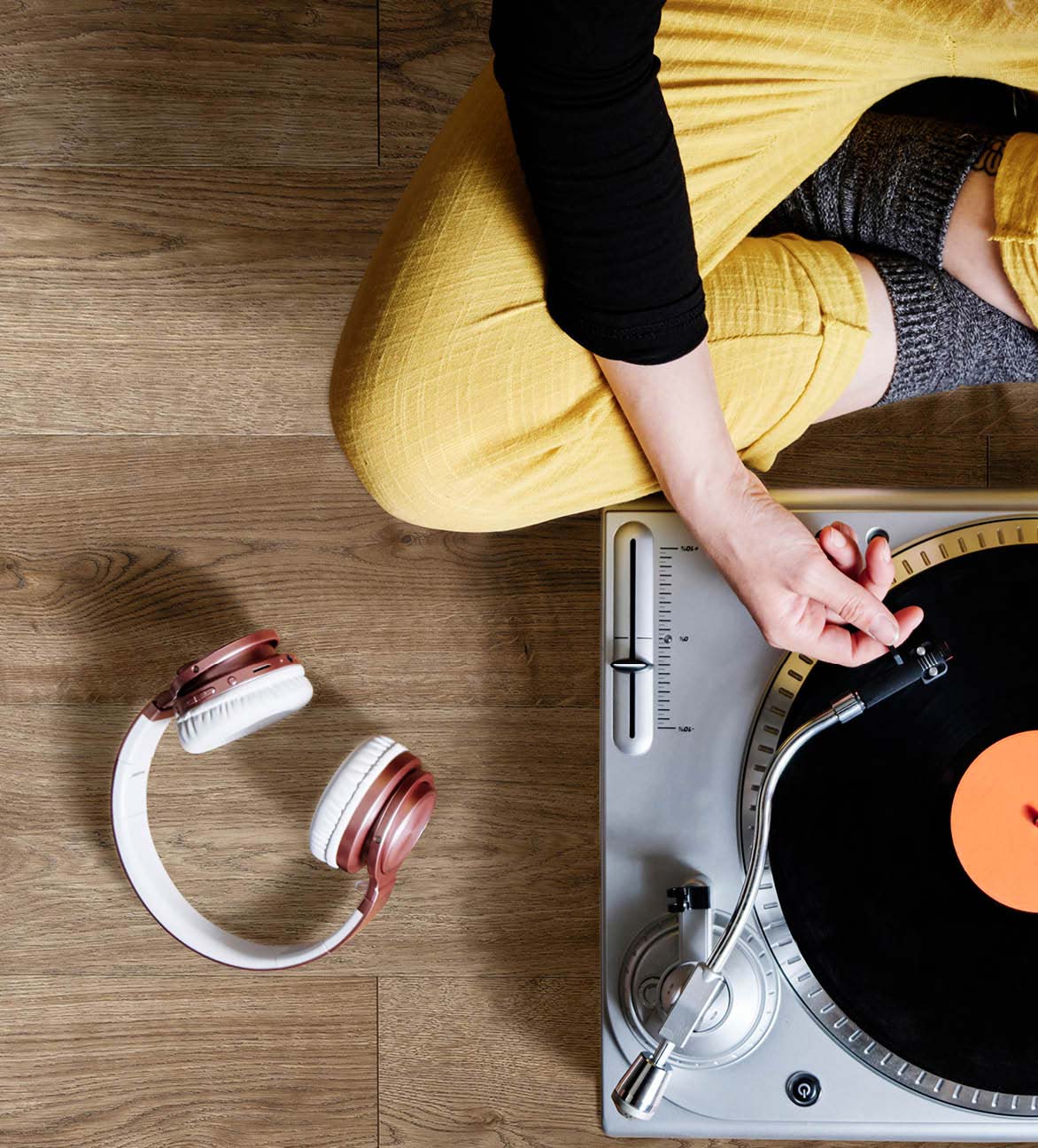 Record player on engineered wood flooring in a home